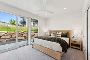 Bedroom featuring carpet flooring, access to exterior, recessed lighting, ceiling fan, and a closet