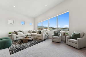 Carpeted living room featuring recessed lighting and baseboards