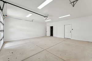 Garage featuring baseboards