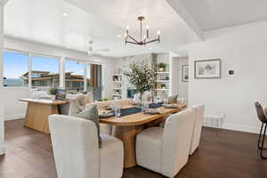 Dining space featuring a chandelier, wood finished floors, recessed lighting, and a ceiling fan