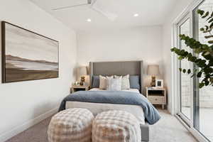 Bedroom with carpet, access to exterior, a skylight, recessed lighting, and a ceiling fan