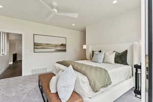 Bedroom featuring carpet flooring, recessed lighting, a skylight, and a ceiling fan