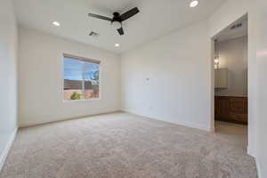 Unfurnished room featuring ceiling fan, carpet floors, visible vents, and recessed lighting