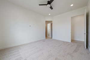 Unfurnished bedroom with recessed lighting, baseboards, and light colored carpet