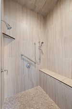 Full bathroom featuring a tile shower