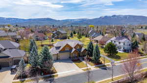 Drone / aerial view with a mountain view and a residential view
