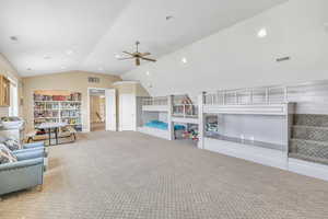 Game room with visible vents, lofted ceiling, carpet flooring, and ceiling fan