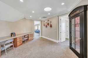 Home office with baseboards, visible vents, recessed lighting, light colored carpet, and crown molding