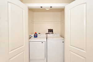 Laundry room featuring washer and dryer and laundry area