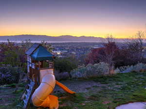 View of playground with a mountain view