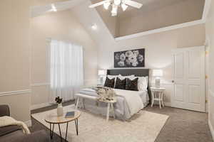 Bedroom with baseboards, carpet floors, high vaulted ceiling, and ceiling fan