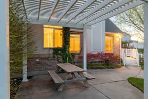 View of patio featuring outdoor dining area and a pergola