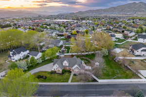 Aerial view at dusk with a residential view and a mountain view