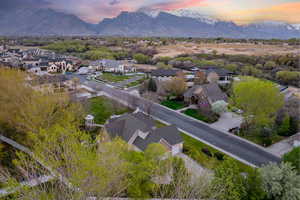 Aerial view at dusk featuring a residential view and a mountain view