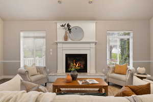 Living room featuring baseboards and a fireplace