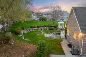 View of yard featuring a gazebo, and fence