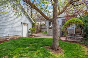 View of the rear of garage with the door leading to the house.