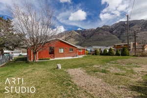 Exterior space with a mountain view and fence