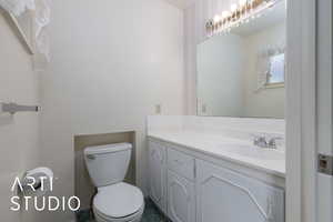 Bathroom featuring toilet and vanity