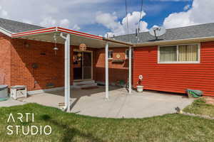 Back of property featuring entry steps, roof with shingles, central AC unit, and a patio area