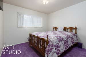 Carpeted bedroom with baseboards