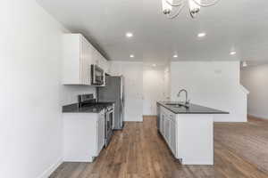 Kitchen, with stainless steel appliances and gas range.