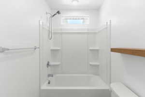 Master Bathroom featuring shower / bathing tub combination and toilet