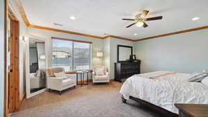 Carpeted bedroom featuring recessed lighting and crown molding