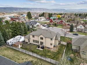 Birds eye view of property featuring a residential view and a mountain view