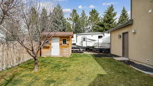 View of yard featuring fence
