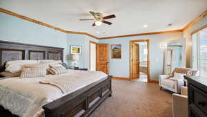 Bedroom featuring baseboards, a textured ceiling, carpet flooring, and crown molding