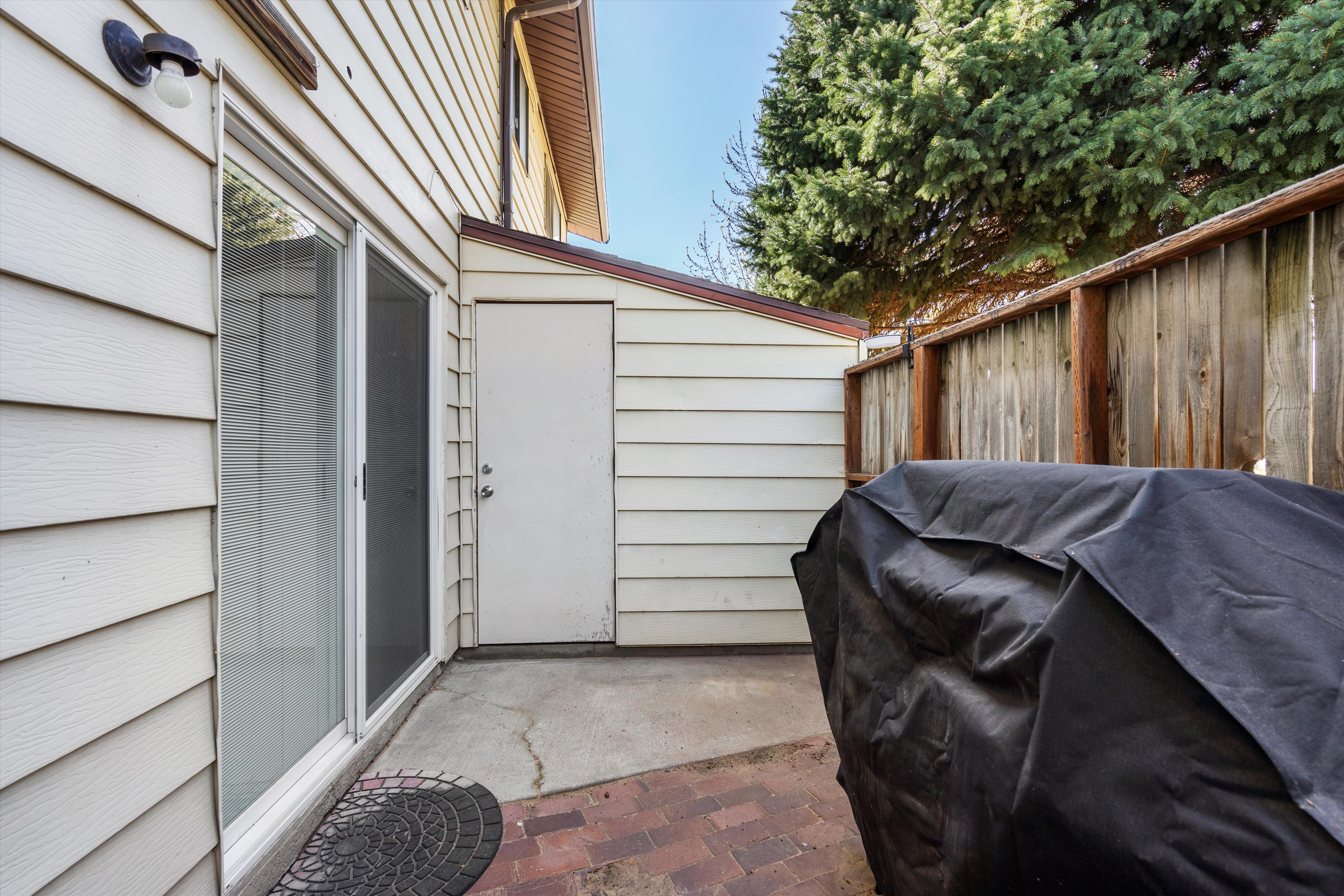 View of patio with fence