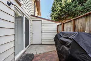 View of patio with fence