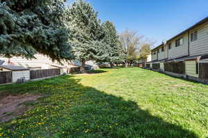 View of yard featuring fence