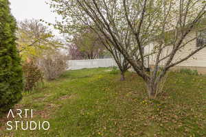 View of yard with fence