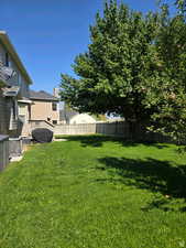 View of yard featuring fence