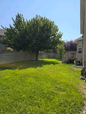 View of yard featuring a fenced backyard and a wooden deck