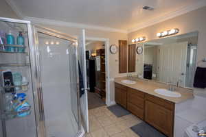 Principle Bathroom with a sink, visible vents, and a stall shower