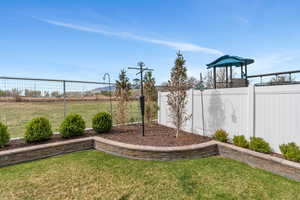View of yard featuring fence