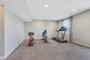 Workout area featuring baseboards, carpet floors, and recessed lighting