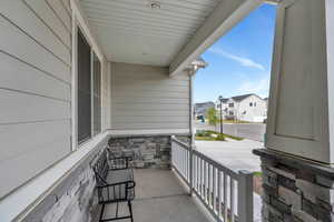 Balcony with covered porch and a residential view