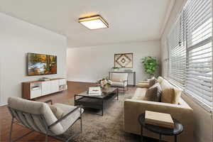 Living area featuring baseboards and wood finished floors