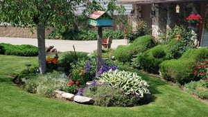 Beautifully landscaped front yard. Sit on your covered porch and enjoy the birds, or watch them through the front window in the breakfast nook.