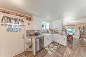 Door in kitchen leads to the carport. Granite countertops. LVP flooring. All appliances are included.