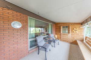 Balcony deck off of family room features sun shades, as balcony faces west. Deck feeds into a cute sun room. Great views of the valley and amazing sunsets!