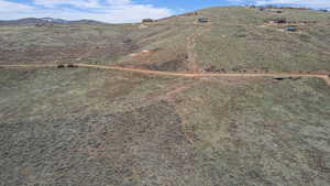 Birds eye view of property with a mountain view