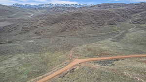 Birds eye view of property with a mountain view