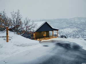 View of snow covered exterior with a mountain view