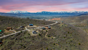 Aerial view at dusk featuring a mountain view