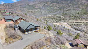 Birds eye view of property with a mountain view